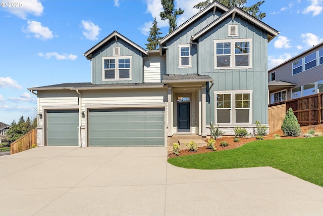 23019 Bland Cir, West Linn, OR 97068 - craftsman-style home with board and batten siding, concrete driveway, stone siding, and a garage