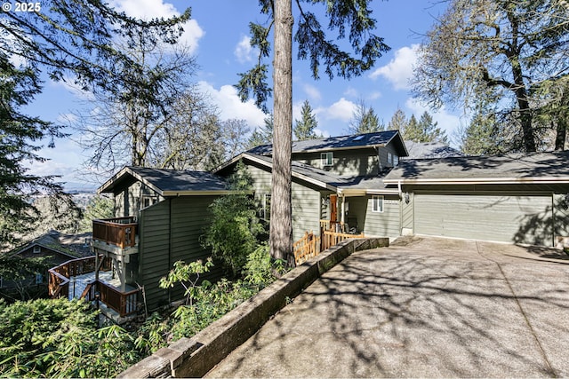 view of home's exterior with driveway and an attached garage