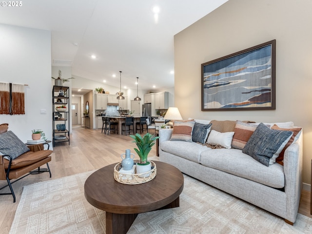 235 NW 29th Way, Battle Ground, WA 98604 - living room featuring light wood-style floors, vaulted ceiling, and recessed lighting