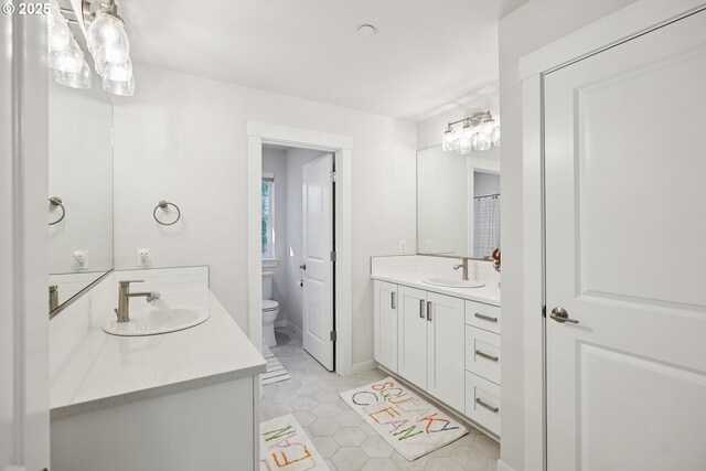 12545 SW Palermo St, Wilsonville, OR 97070 - full bathroom featuring toilet, vanity, and tile patterned floors