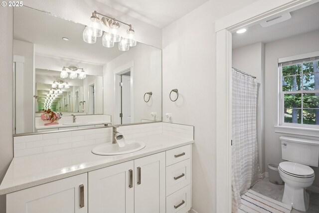 12545 SW Palermo St, Wilsonville, OR 97070 - bathroom featuring toilet, vanity, a shower with shower curtain, and baseboards