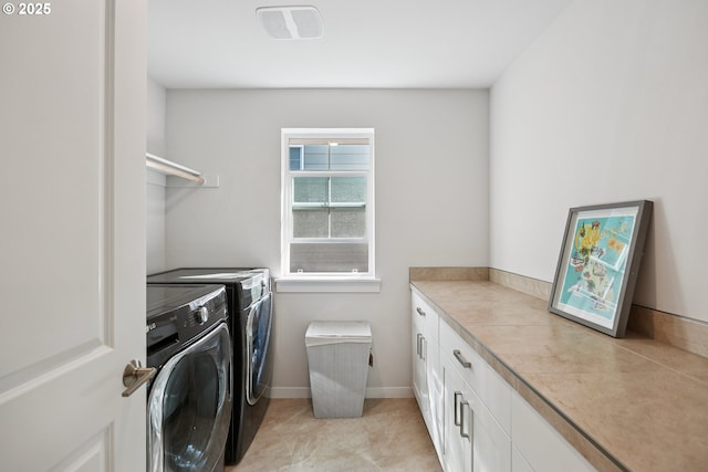 12545 SW Palermo St, Wilsonville, OR 97070 - laundry area with independent washer and dryer, cabinet space, and baseboards