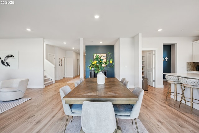 12545 SW Palermo St, Wilsonville, OR 97070 - dining room featuring stairs, light wood finished floors, recessed lighting, and baseboards