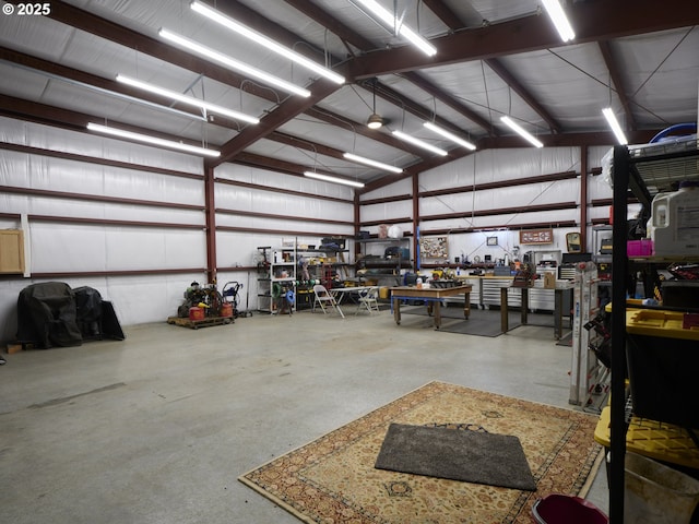 garage featuring a workshop area and metal wall