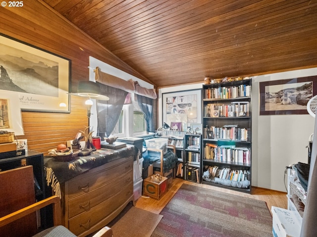 interior space featuring vaulted ceiling, wood ceiling, and wood finished floors