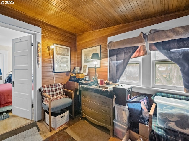 interior space with wood finished floors, wooden walls, and wood ceiling