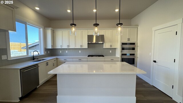 11684 SW 178th Dr, Beaverton, OR 97007 - kitchen featuring extractor fan, appliances with stainless steel finishes, tasteful backsplash, and white cabinetry