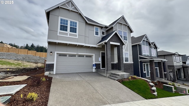 craftsman inspired home featuring fence, driveway, stucco siding, and an attached garage