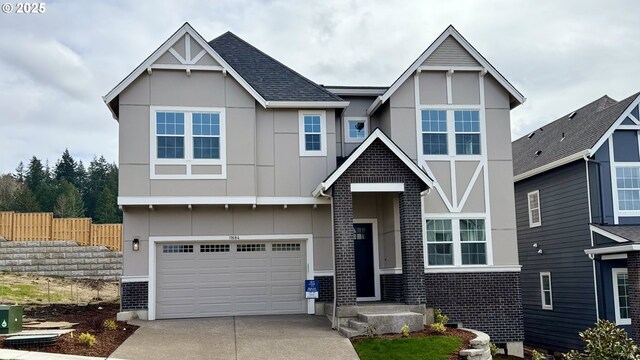 11684 SW 178th Dr, Beaverton, OR 97007 - view of front of home featuring concrete driveway, an attached garage, and brick siding