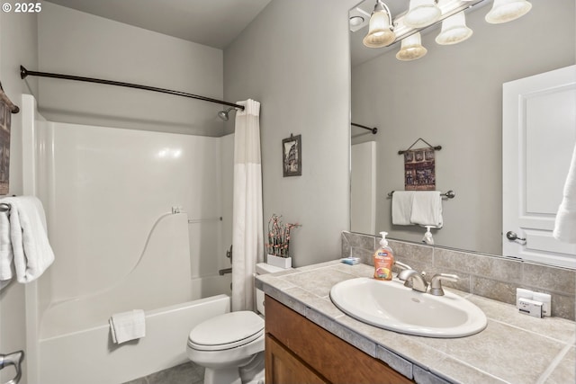 full bathroom featuring vanity, shower / bath combination with curtain, and toilet