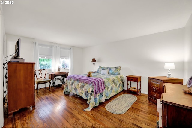 bedroom featuring wood finished floors