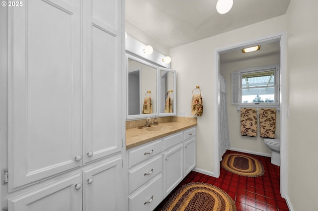 bathroom featuring vanity, baseboards, toilet, and curtained shower