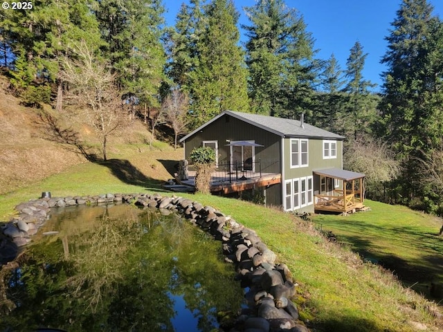 exterior space with a yard and a deck