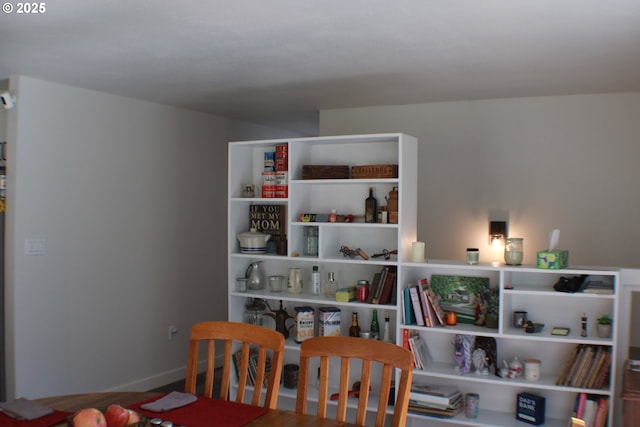 dining room featuring baseboards