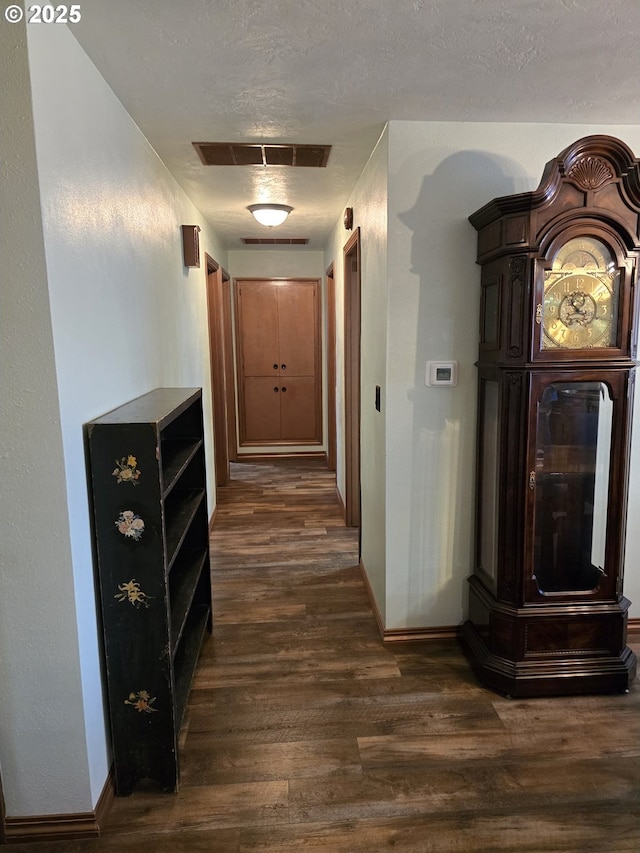 corridor with dark wood-type flooring