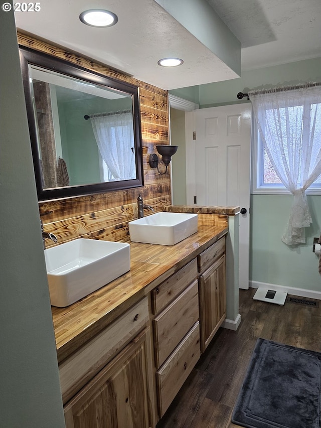 bathroom featuring hardwood / wood-style floors and vanity