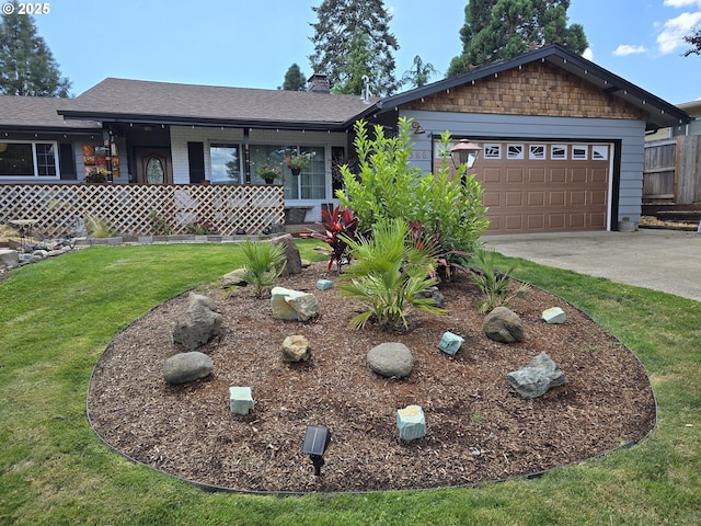 ranch-style home with a front lawn and a garage