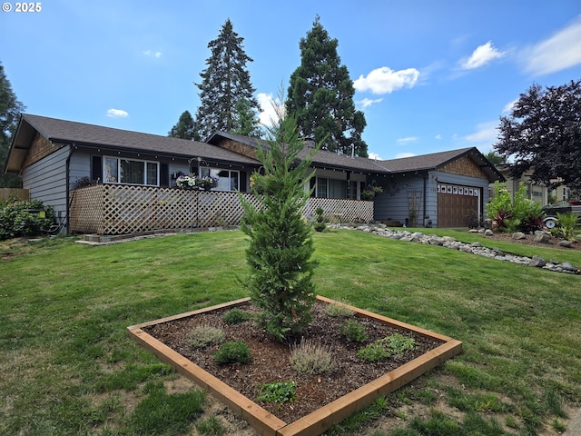 ranch-style house featuring a front yard and a garage