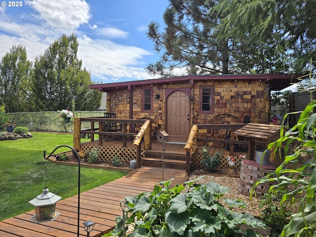 exterior space featuring a deck and a yard