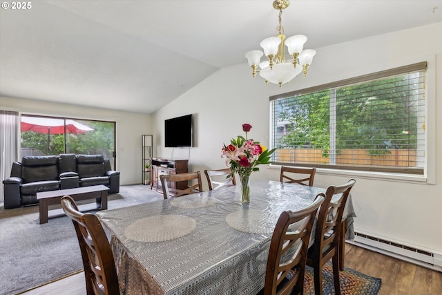 18366 SW Jann Dr, Beaverton, OR 97003 - dining room featuring lofted ceiling, a chandelier, a baseboard heating unit, healthy amount of natural light, and wood finished floors