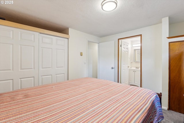 18366 SW Jann Dr, Beaverton, OR 97003 - carpeted bedroom featuring a closet, a textured ceiling, and ensuite bathroom