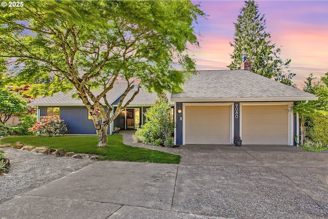 9080 NW Sherry Ct, Portland, OR 97229 - view of front of home with a chimney, a yard, driveway, and an attached garage