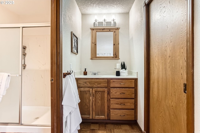 9080 NW Sherry Ct, Portland, OR 97229 - full bath featuring a shower stall, vanity, and a textured ceiling