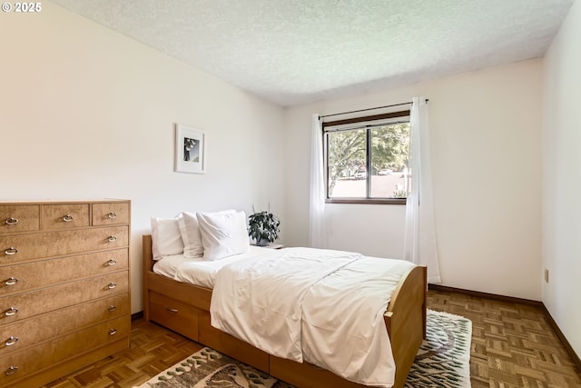 9080 NW Sherry Ct, Portland, OR 97229 - bedroom with a textured ceiling and baseboards