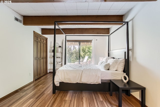 9080 NW Sherry Ct, Portland, OR 97229 - bedroom featuring wood finished floors and beamed ceiling