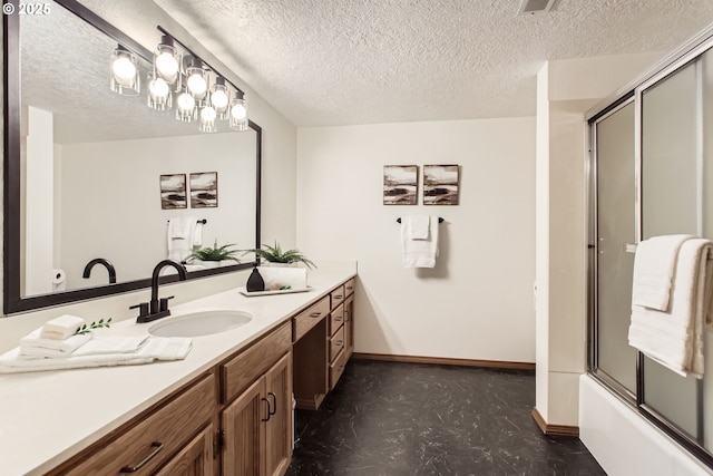 9080 NW Sherry Ct, Portland, OR 97229 - full bathroom featuring tile patterned floors, vanity, a textured ceiling, and combined bath / shower with glass door