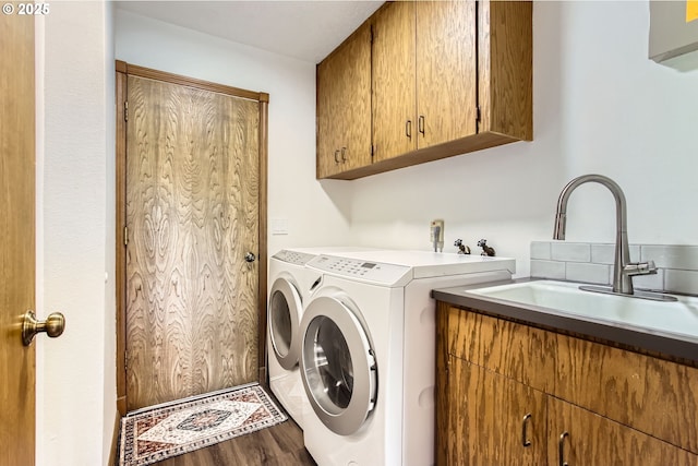 9080 NW Sherry Ct, Portland, OR 97229 - clothes washing area featuring cabinet space, separate washer and dryer, and wood finished floors