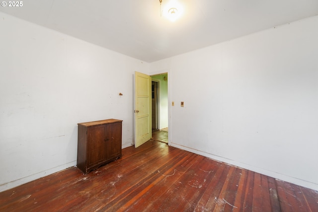 empty room with hardwood / wood-style floors