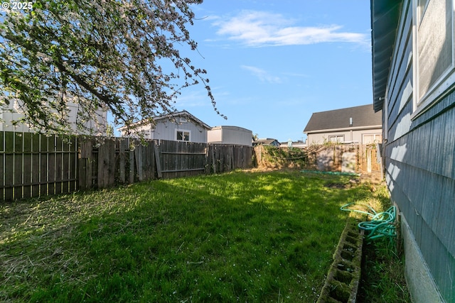 view of yard with a fenced backyard