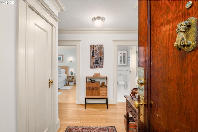 2083 NW Johnson St Unit 66, Portland, OR 97209 - corridor featuring light wood-style flooring and crown molding
