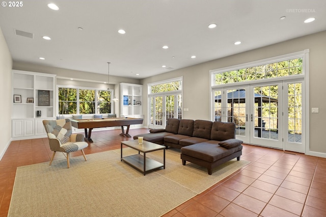 living area featuring recessed lighting, visible vents, tile patterned flooring, and french doors