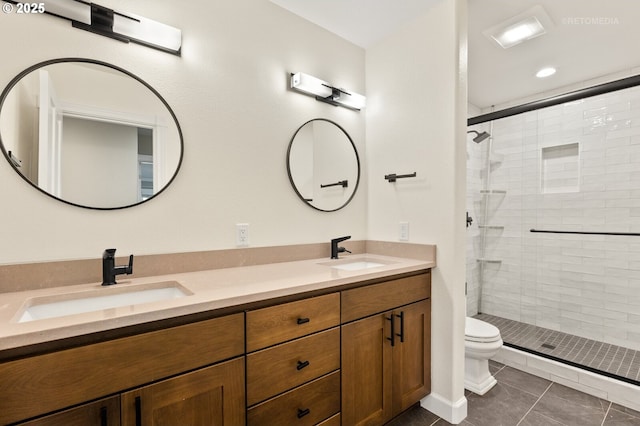 full bathroom with a stall shower, a sink, and toilet