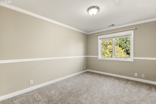 empty room with baseboards, carpet, visible vents, and a textured ceiling