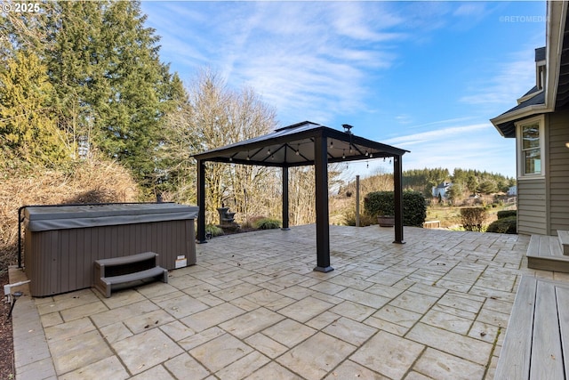 view of patio featuring a gazebo and a hot tub