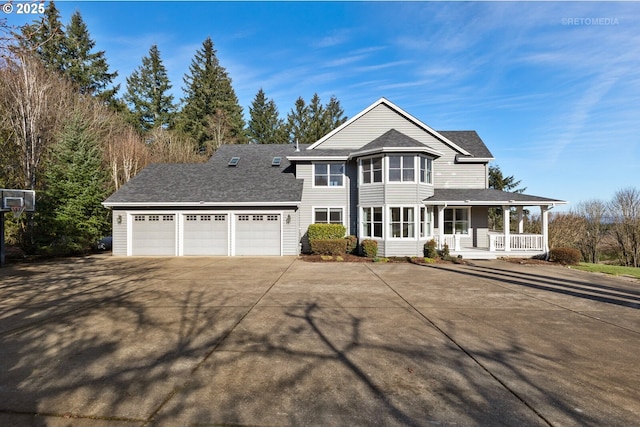 view of front of house with a garage, a porch, concrete driveway, and roof with shingles