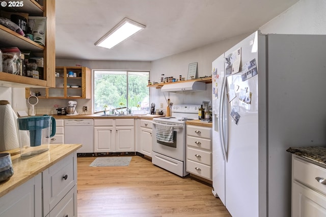 29882 S Hult Rd, Colton, OR 97017 - kitchen featuring white appliances, range hood, light wood-style floors, open shelves, and glass insert cabinets