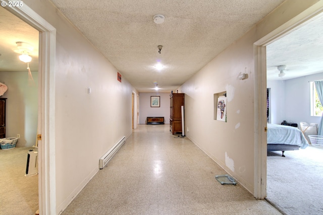 29882 S Hult Rd, Colton, OR 97017 - hallway with a baseboard heating unit, a textured ceiling, and light flooring