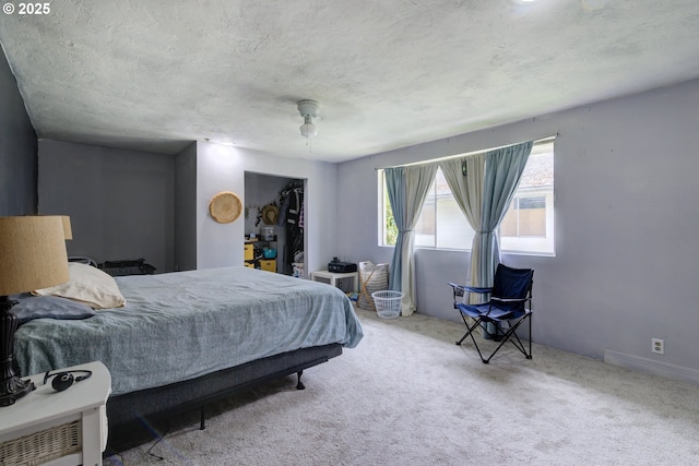 29882 S Hult Rd, Colton, OR 97017 - carpeted bedroom with a closet, a ceiling fan, a walk in closet, and a textured ceiling