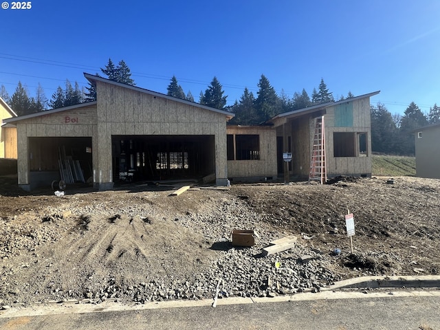 property in mid-construction with a garage