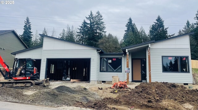 view of front of house with crawl space, driveway, and a garage