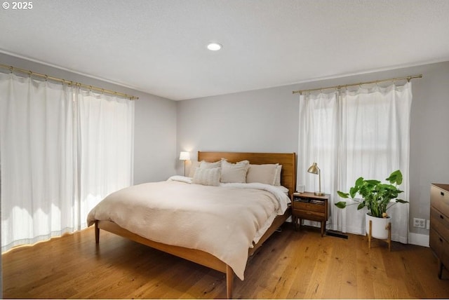 10701 SE Stevens Way, Happy Valley, OR 97086 - bedroom featuring light wood-style flooring and recessed lighting