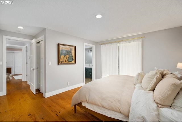 10701 SE Stevens Way, Happy Valley, OR 97086 - bedroom with baseboards, recessed lighting, light wood-type flooring, ensuite bathroom, and a closet