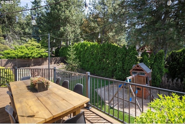 10701 SE Stevens Way, Happy Valley, OR 97086 - view of wooden balcony featuring outdoor dining space, a deck, and view of scattered trees