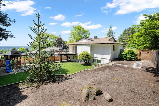 10701 SE Stevens Way, Happy Valley, OR 97086 - back of house featuring a chimney, a playground, and a deck