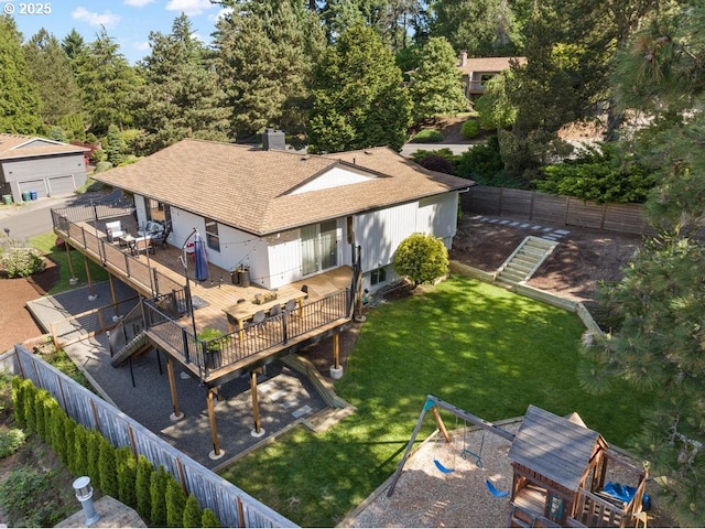 10701 SE Stevens Way, Happy Valley, OR 97086 - rear view of house featuring a playground, a deck, and a shingled roof