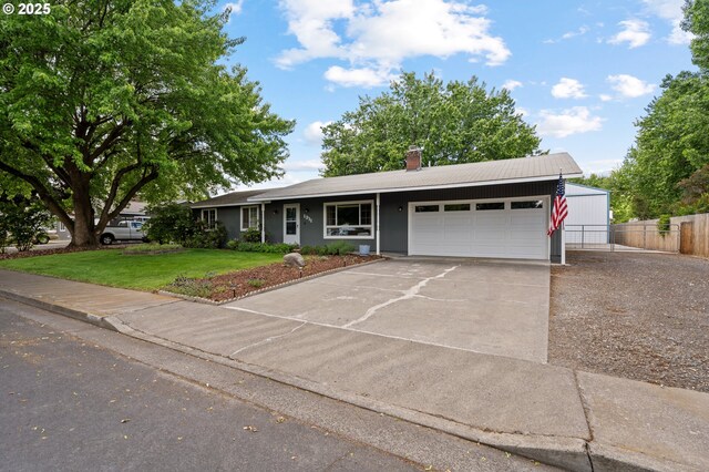 1911 SW Vista Pl, Pendleton, OR 97801 - ranch-style home featuring an attached garage, concrete driveway, and a chimney